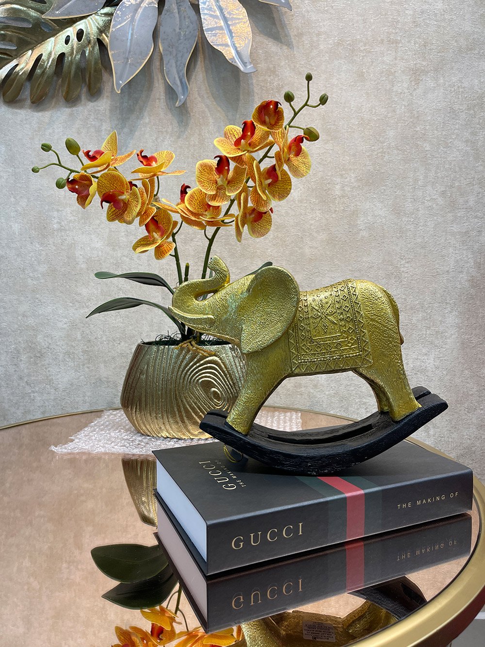 Elefante dorado balancin